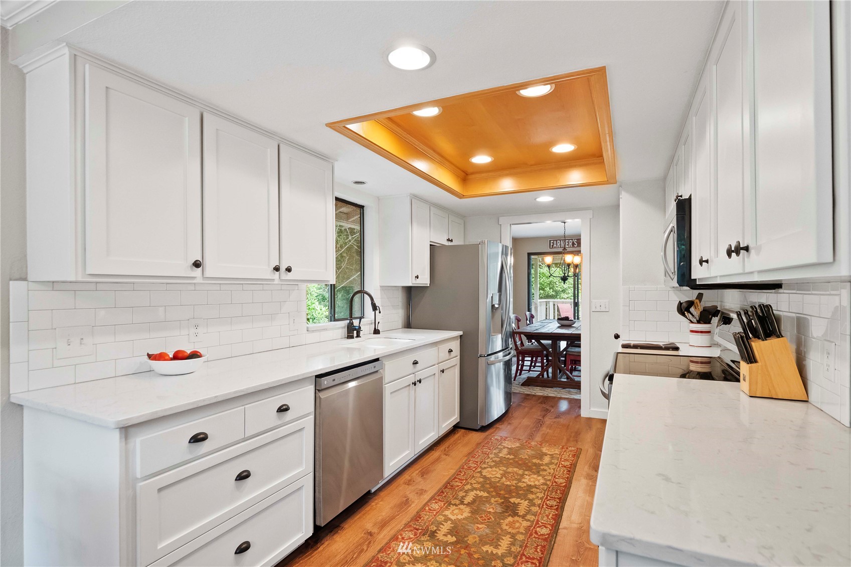 22224 3rd Avenue Southeast Bothell, WA 98021 - Photo 5 of 30 a kitchen with white cabinets and sink