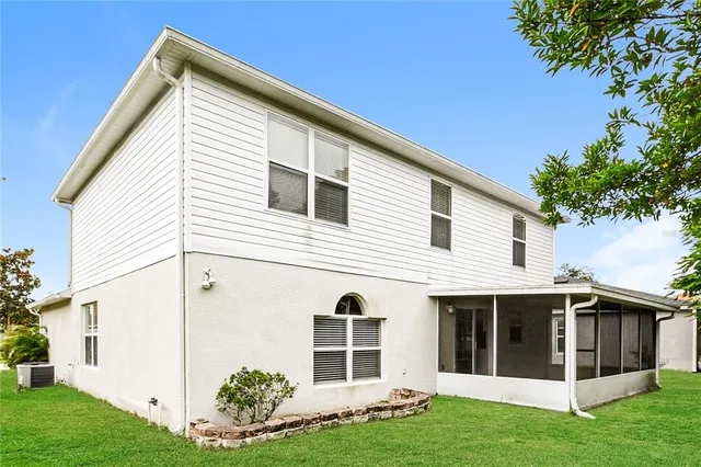 a view of front of house with a yard