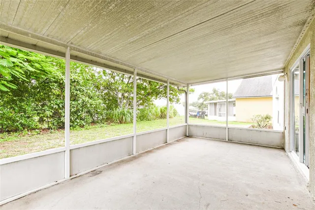 a view of an empty room with a large window