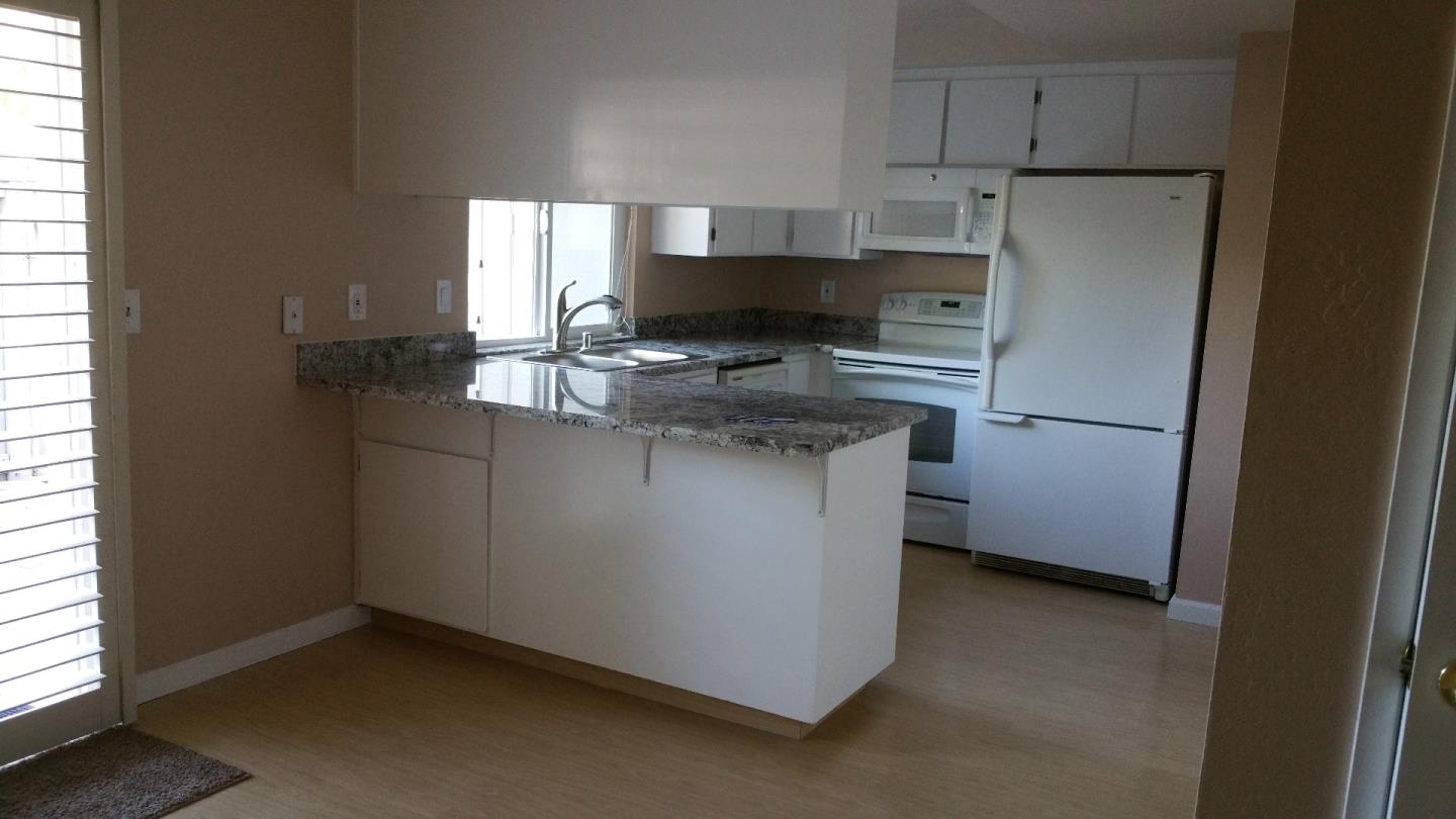 2824 Bollinger Canyon Road San Ramon, CA 94583 - Photo 2 of 22 a kitchen with stainless steel appliances granite countertop a refrigerator a sink a stove a microwave a sink and a refrigerator