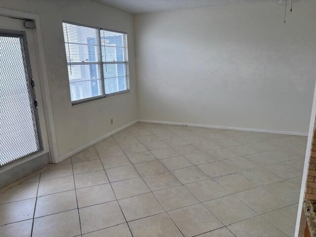 2035 Exeter, Unit 2035 Boca Raton, FL 33434 - Photo 4 of 15 an empty room with windows