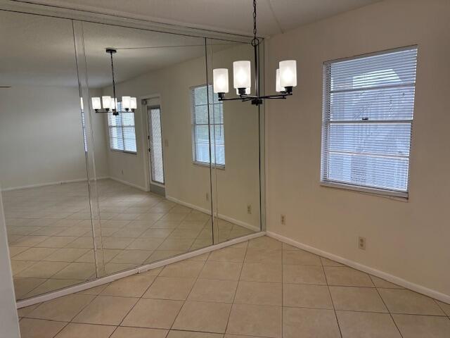 2035 Exeter, Unit 2035 Boca Raton, FL 33434 - Photo 5 of 15 a view of a kitchen with a sink and chandelier