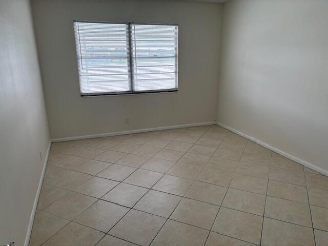 2035 Exeter, Unit 2035 Boca Raton, FL 33434 - Photo 8 of 15 an empty room with a window