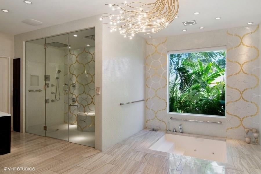 6900 Southeast Harbor Circle Stuart, FL 34996 - Photo 7 of 33 a view of a bathroom with a shower and a window