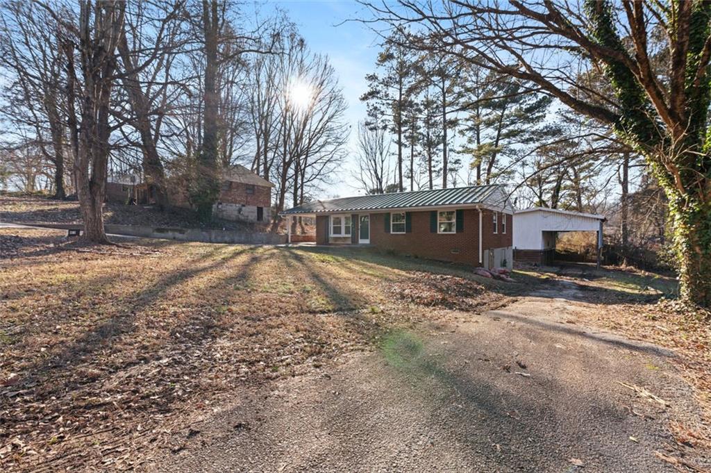 4619 Ryan Road Conley, GA 30288 - Photo 1 of 1 a view of a house with a yard covered in snow