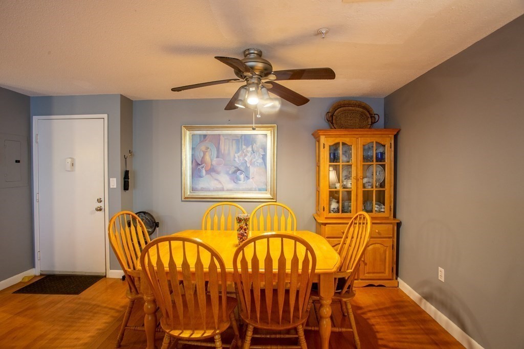 11 Church Street, Unit 101 Salem, MA 01970 - Photo 10 of 31 a dining room with furniture and chandelier