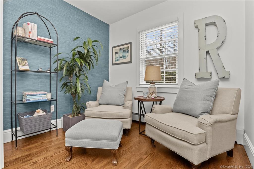 183 Frogtown Road New Canaan, CT 06840 - Photo 13 of 37 a living room with furniture and a large window