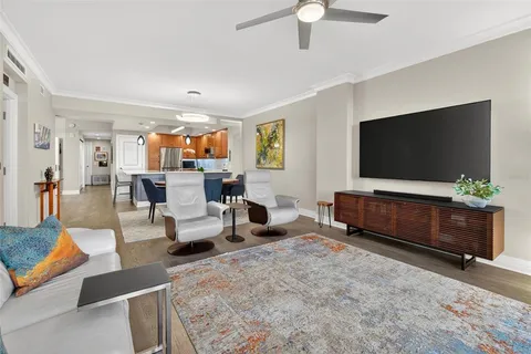 a view of swimming pool with outdoor seating and plants