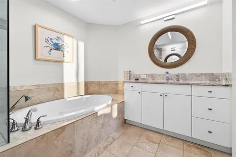 a bedroom with furniture and flat screen tv