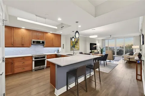 a kitchen with lots of counter top space and stainless steel appliances