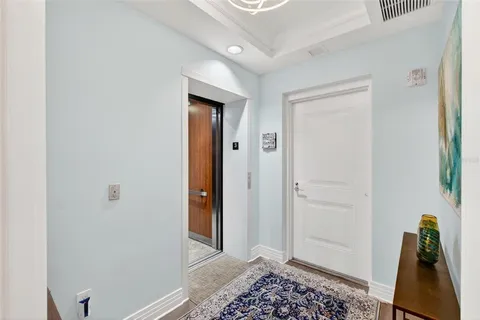 a living room with furniture and painting on the wall