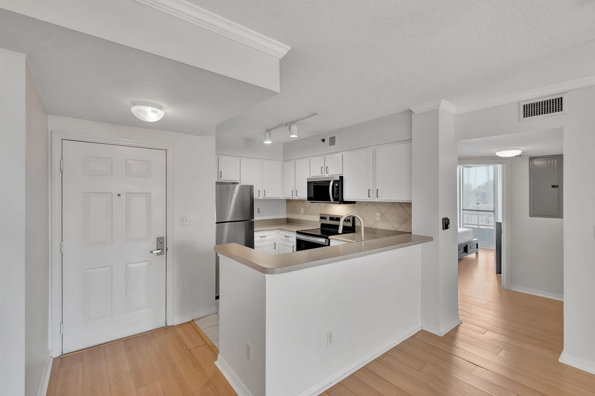 2665 Southwest 37th Avenue, Unit 207 Miami, FL 33133 - Photo 2 of 20 Entry & Kitchen