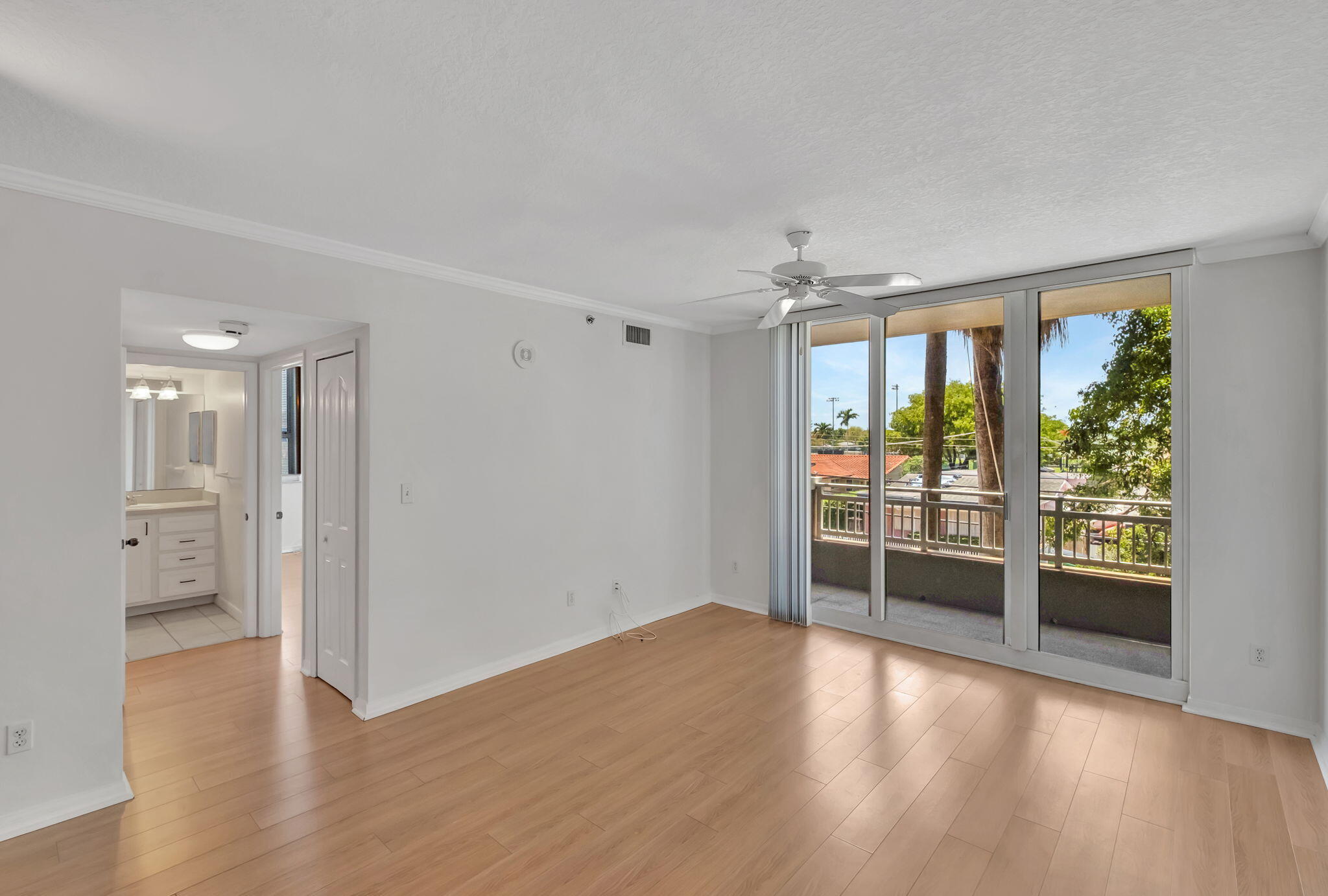 2665 Southwest 37th Avenue, Unit 207 Miami, FL 33133 - Photo 5 of 20 Living Area into Balcony & Second Bedroo