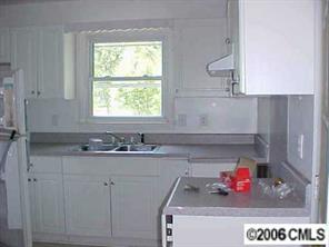 6621 Willow Spring Road Charlotte, NC 28215 - Photo 7 of 7 a bathroom with a sink and a window