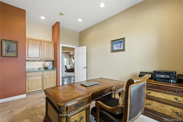 a living room with furniture gym equipment and a window