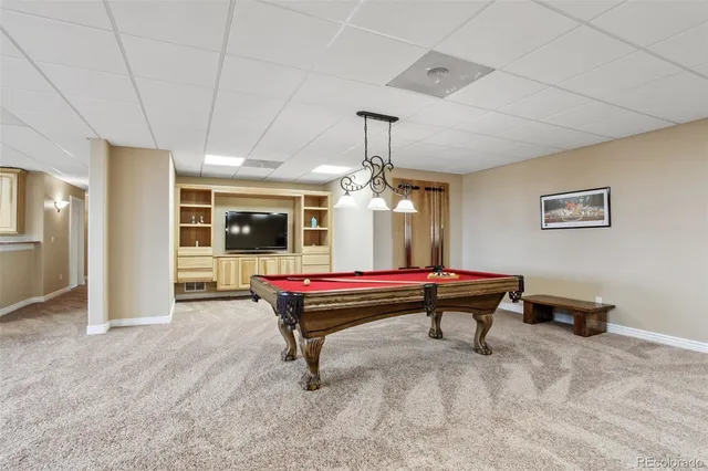 a view of a patio with a table and chairs