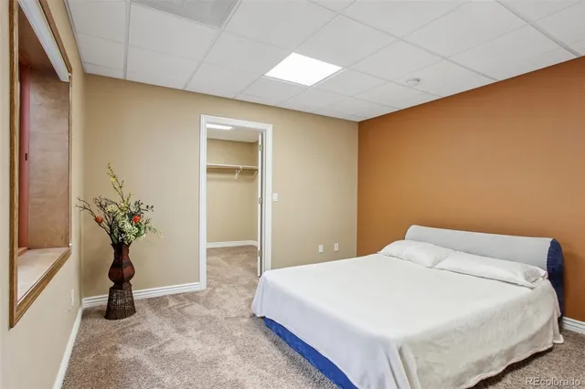 a front view of a house with a yard and outdoor seating