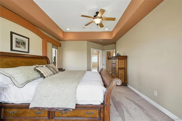 a bed room with a bed and a chair