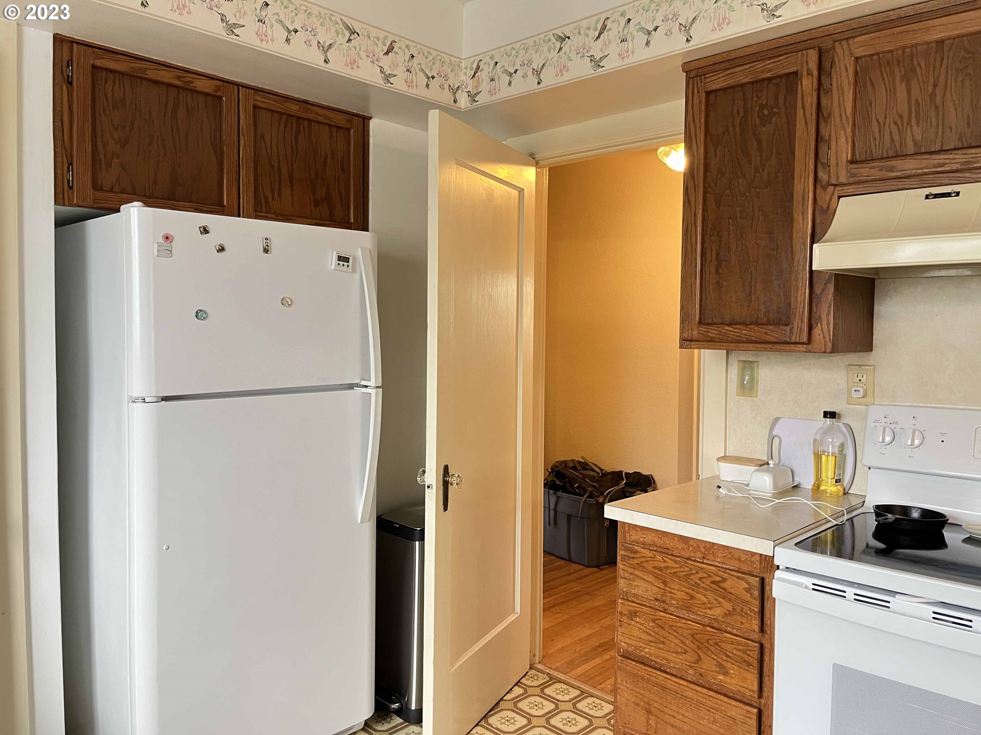 611 Laurel Street Florence, OR 97439 - Photo 16 of 32 a kitchen with a refrigerator and a stove