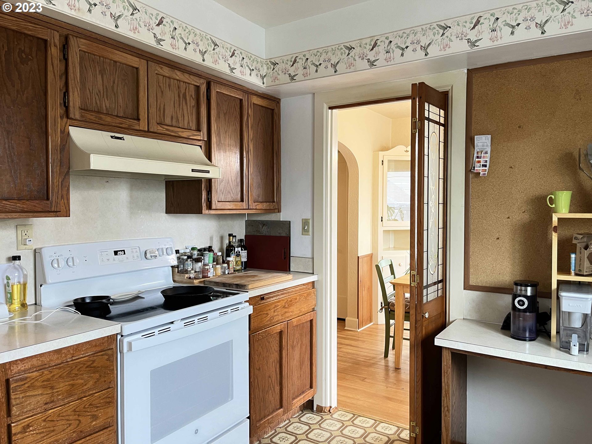 611 Laurel Street Florence, OR 97439 - Photo 17 of 32 a kitchen with stainless steel appliances a stove a sink a refrigerator and cabinets