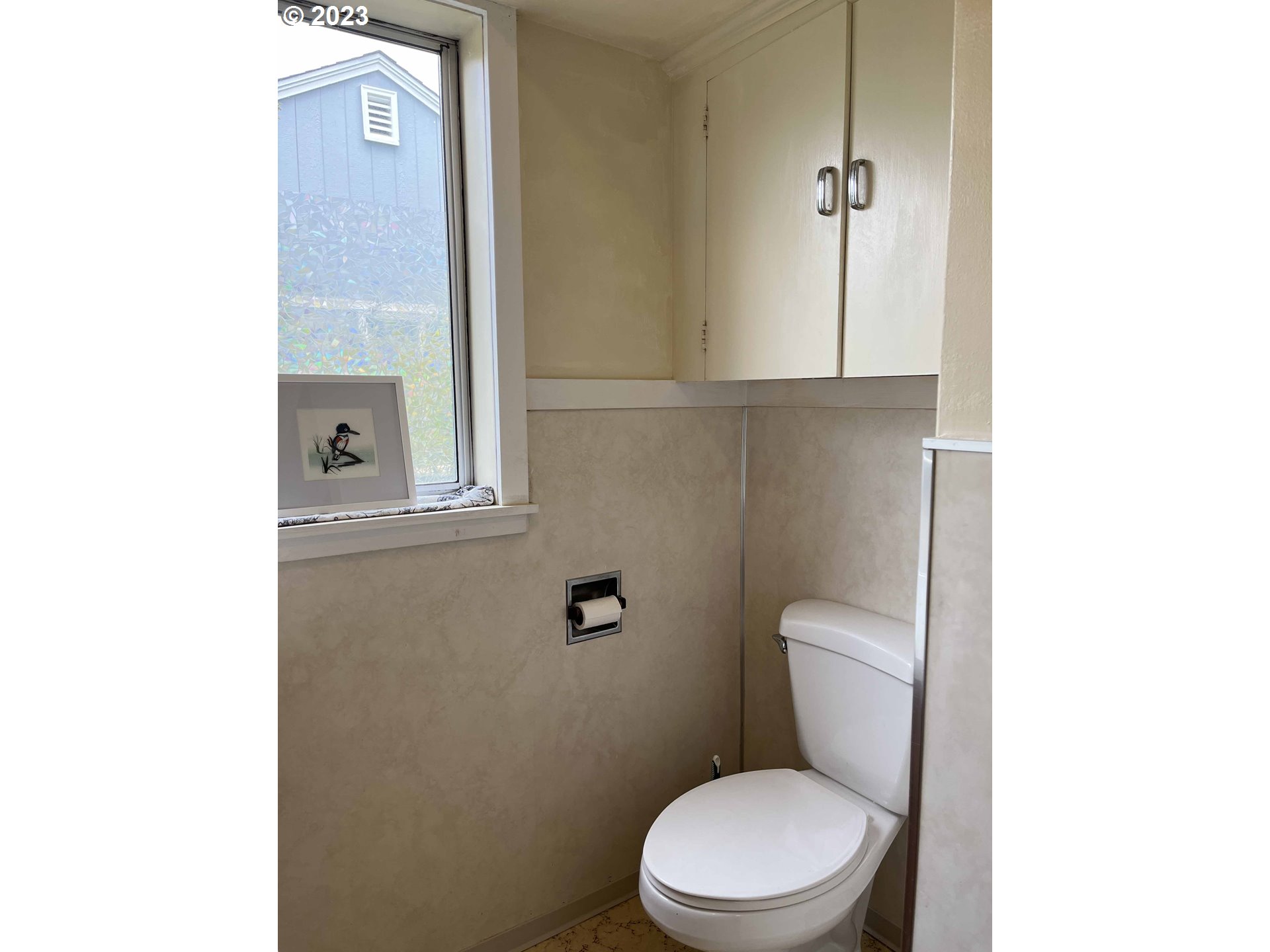 611 Laurel Street Florence, OR 97439 - Photo 22 of 32 a white toilet sitting next to a bathroom sink