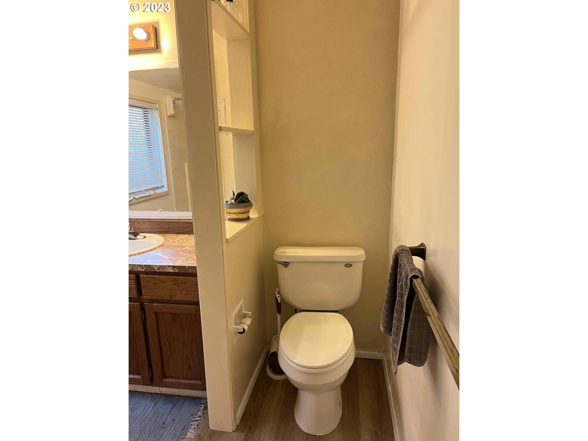 611 Laurel Street Florence, OR 97439 - Photo 28 of 32 a white toilet sitting next to a bathroom sink