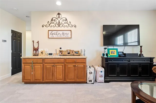 a kitchen with stainless steel appliances a stove and a microwave