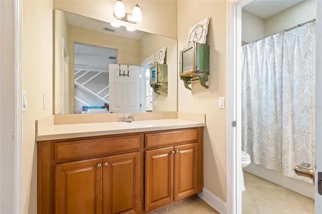 a bathroom with a double vanity sink and a mirror