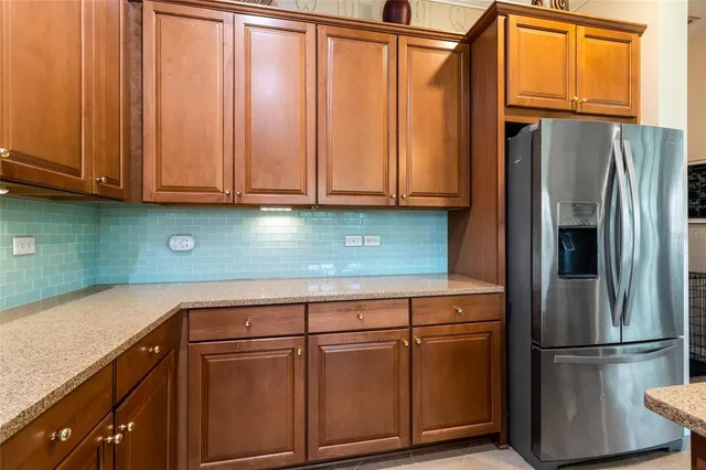 a kitchen with appliances cabinets and a counter top space