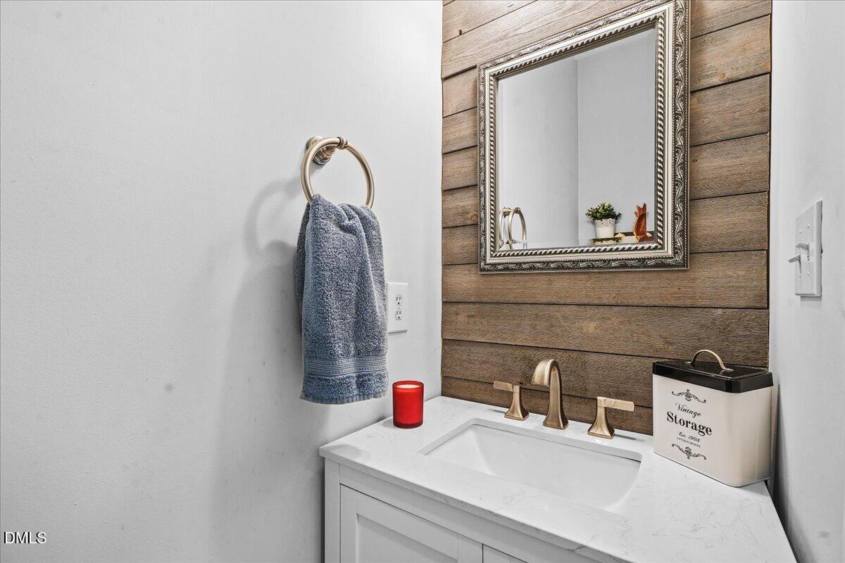 3331 Swinford Court Raleigh, NC 27604 - Photo 25 of 27 a bathroom with a sink and a mirror