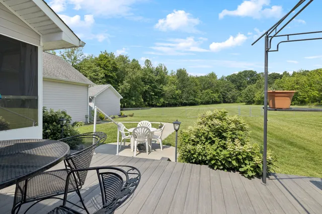 a view of a chair and table on the wooden floor