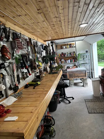 an aerial view of a residential houses with outdoor space and street view