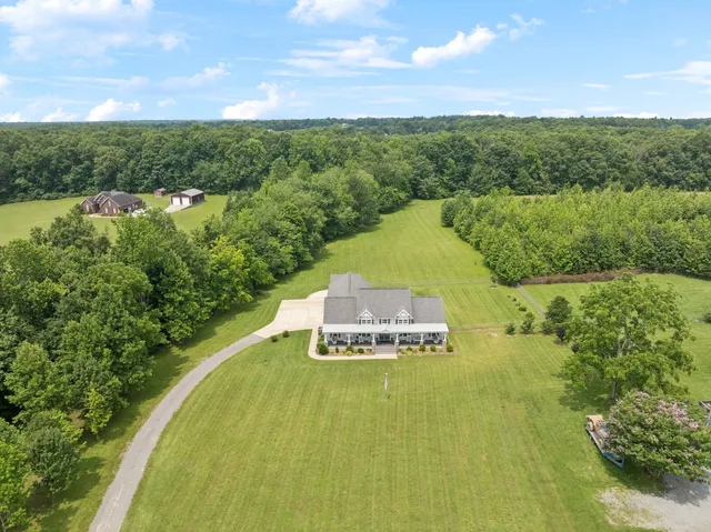 a view of a swimming pool with a yard