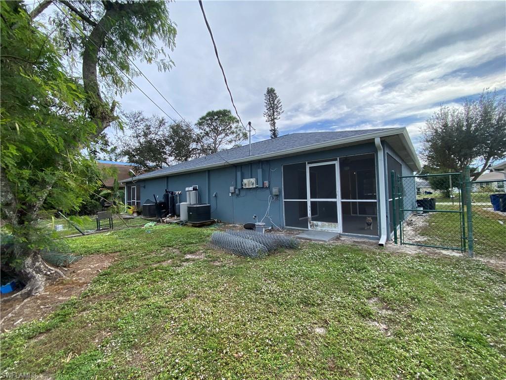 7319 Albany Road Fort Myers, FL 33967 - Photo 23 of 27 a view of a house with backyard and porch