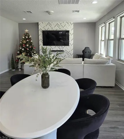 a kitchen with a dining table and chairs