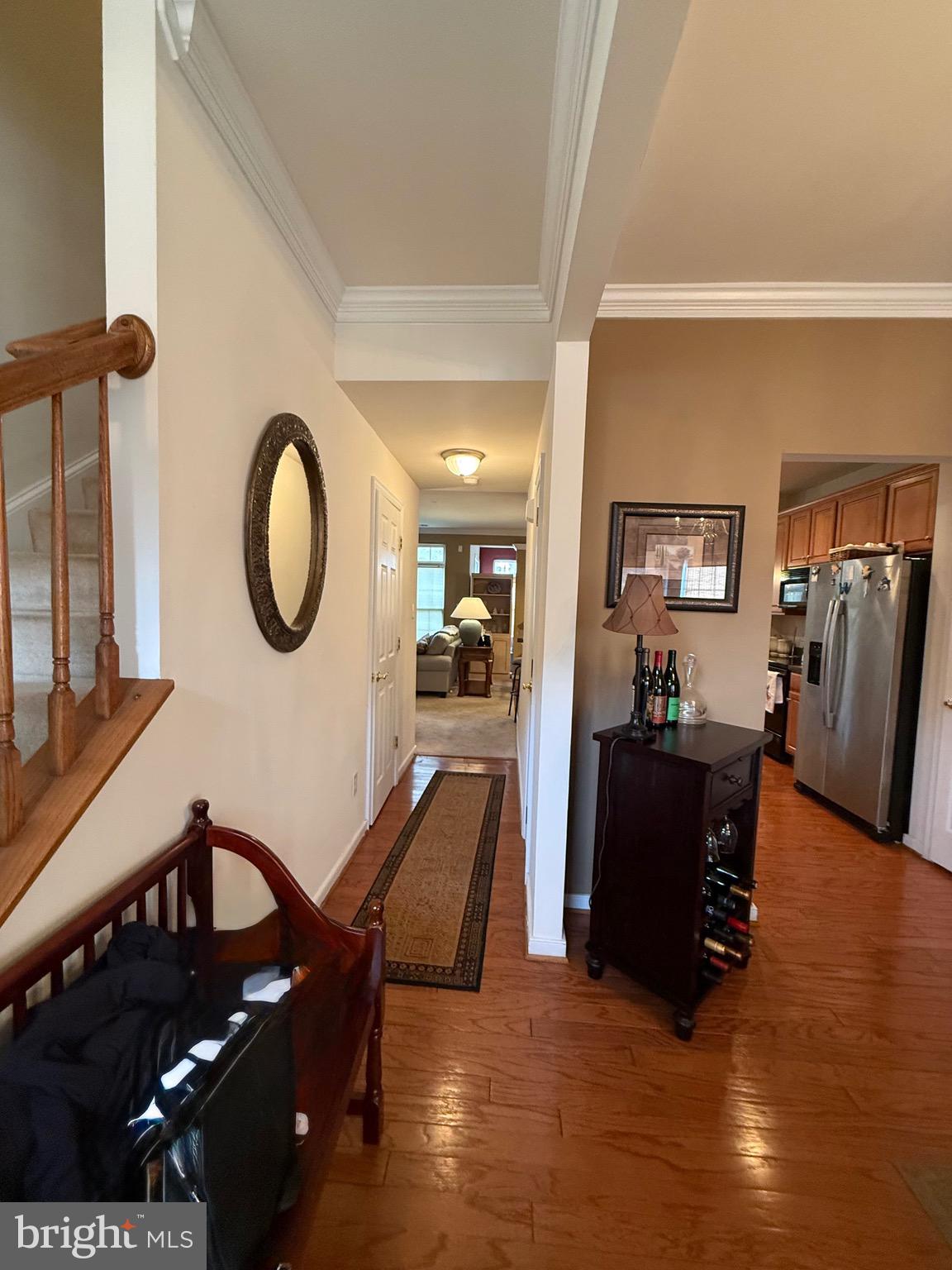 10715 Blackthorn Lane Henrico, VA 23233 - Photo 6 of 16 a living room with furniture a mirror and a clock