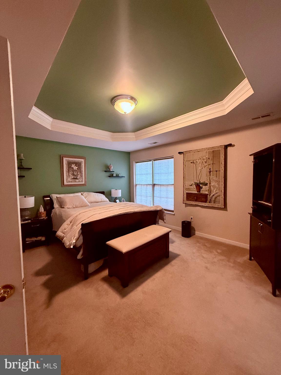 10715 Blackthorn Lane Henrico, VA 23233 - Photo 8 of 16 a bedroom with a bed and a flat screen tv