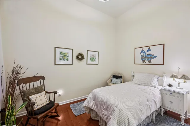 a bedroom with a bed and a table in it