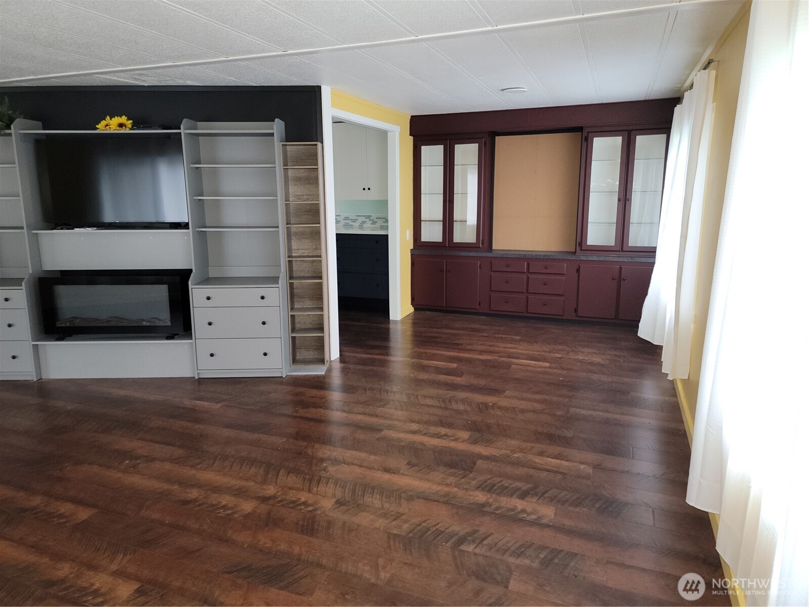 26506 Ridge Avenue Ocean Park, WA 98640 - Photo 11 of 28 a view of wooden floor and windows in a room