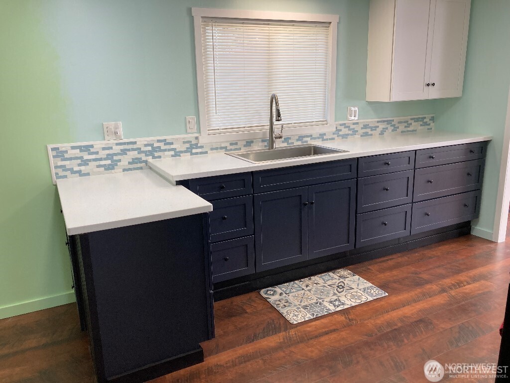 26506 Ridge Avenue Ocean Park, WA 98640 - Photo 14 of 28 a kitchen with a sink and a mirror