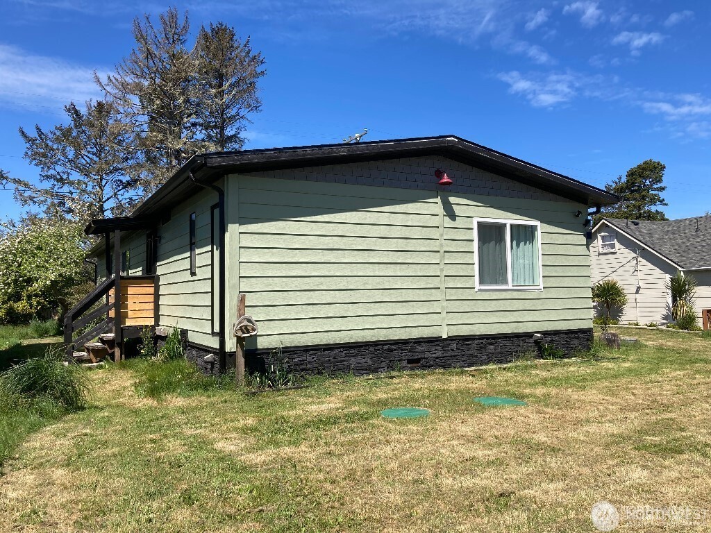 26506 Ridge Avenue Ocean Park, WA 98640 - Photo 2 of 28 a view of a house with a yard