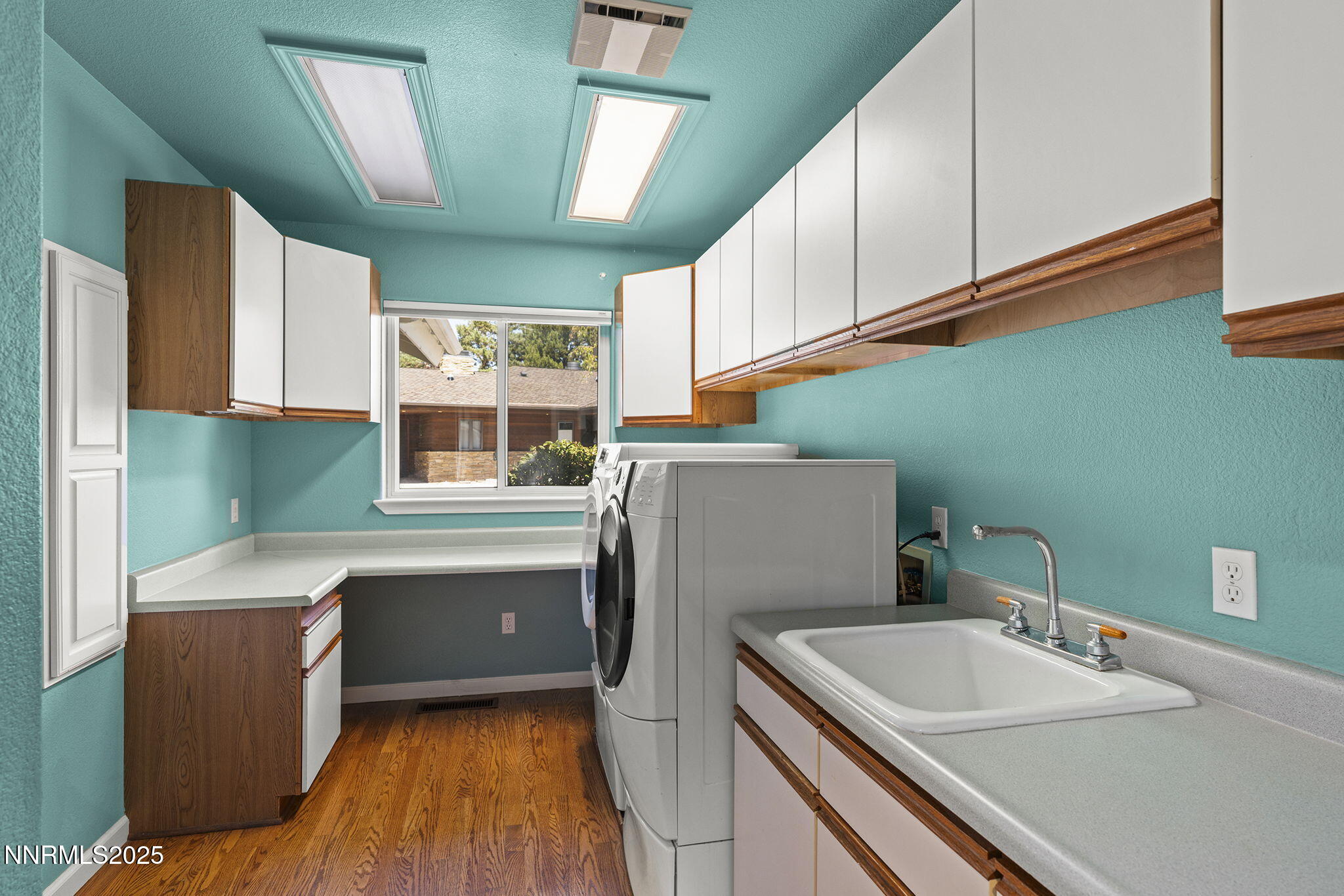 2820 East Lake Ridge Reno, NV 89519 - Photo 12 of 42 a kitchen with sink cabinets and window