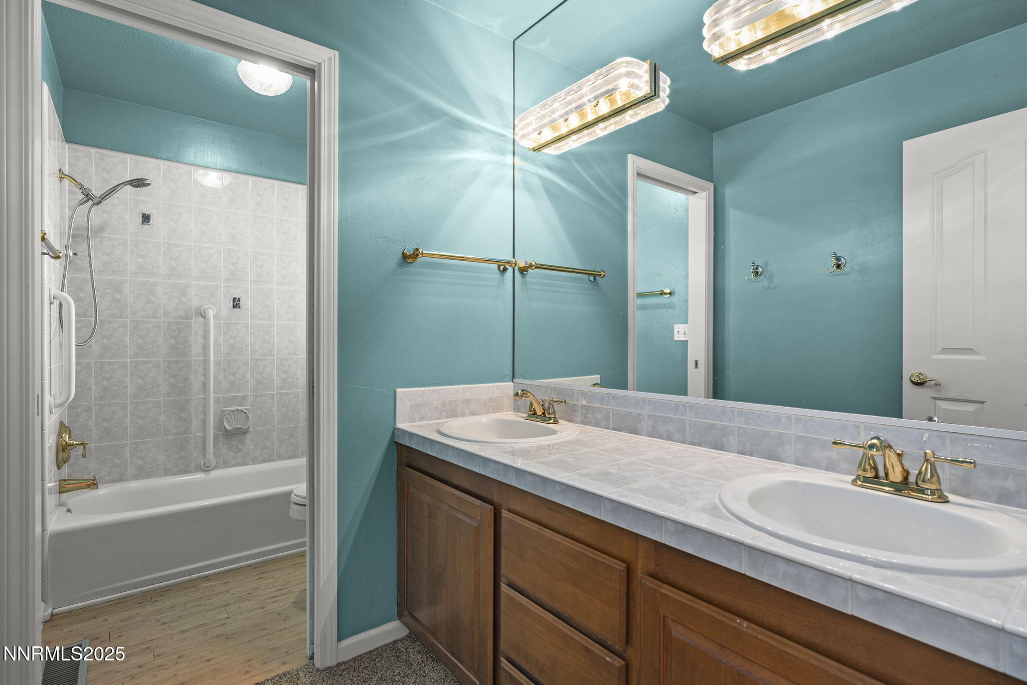 2820 East Lake Ridge Reno, NV 89519 - Photo 21 of 42 a bathroom with a sink and a mirror