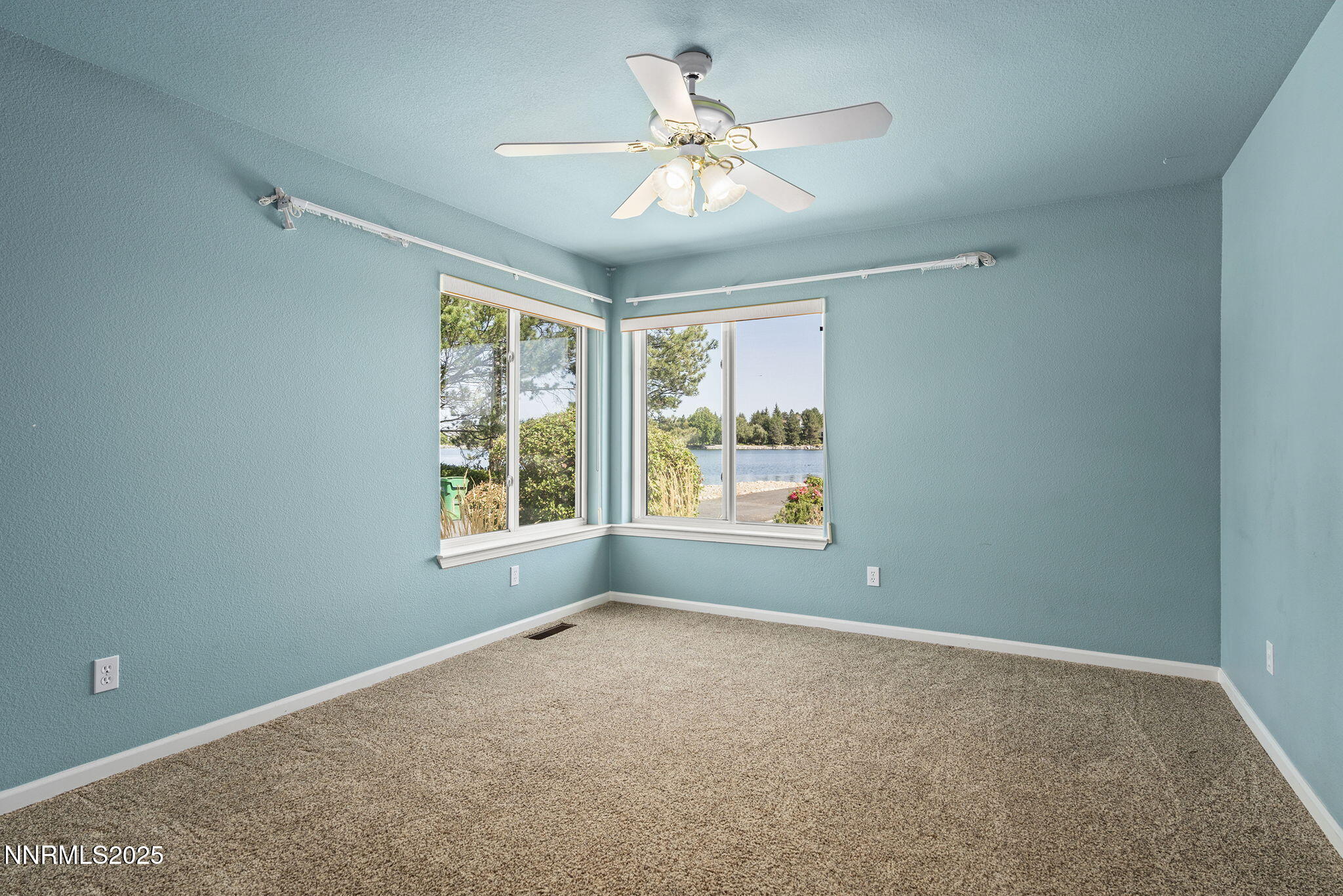 2820 East Lake Ridge Reno, NV 89519 - Photo 22 of 42 a view of a big room with windows and chandelier fan