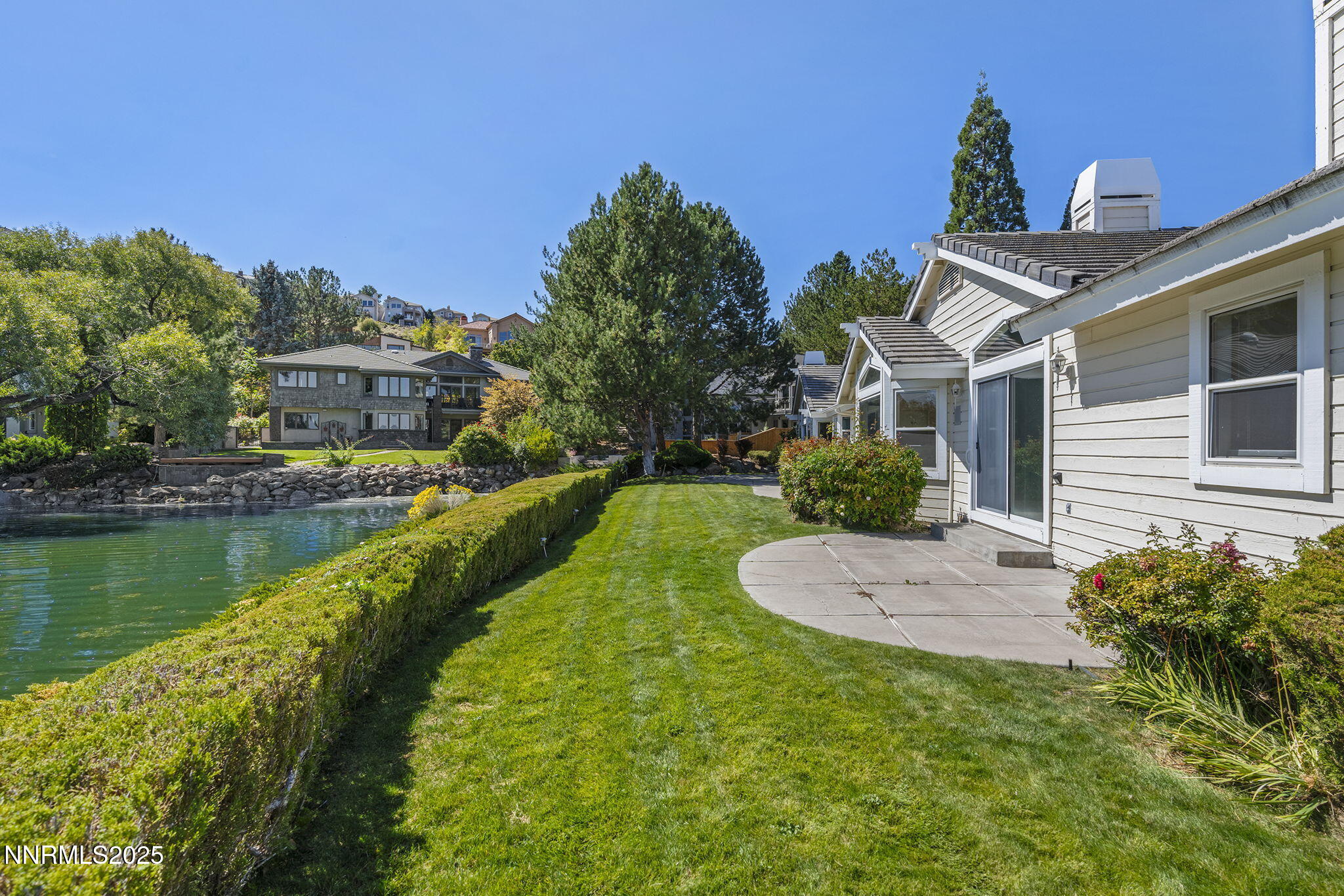 2820 East Lake Ridge Reno, NV 89519 - Photo 28 of 42 a view of a house with a yard and potted plants
