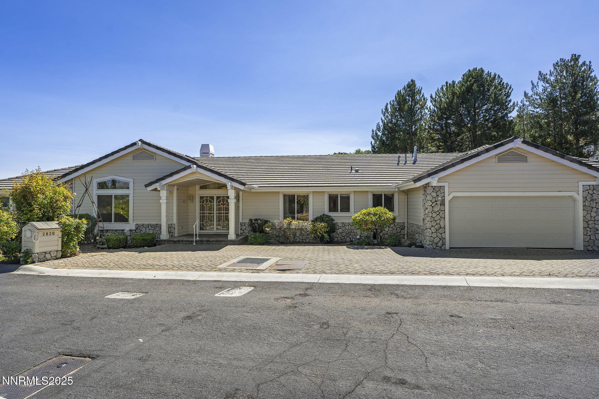 2820 East Lake Ridge Reno, NV 89519 - Photo 4 of 42 a front view of a house with a yard
