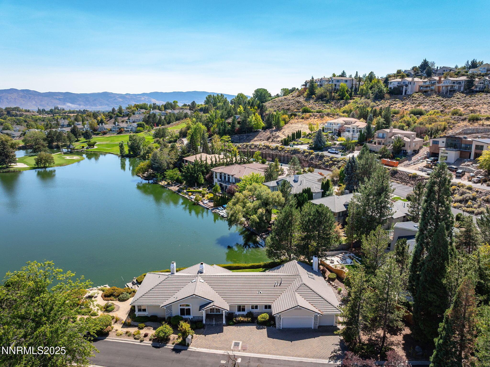 2820 East Lake Ridge Reno, NV 89519 - Photo 5 of 42 an aerial view of a town with swimming pool and mountains