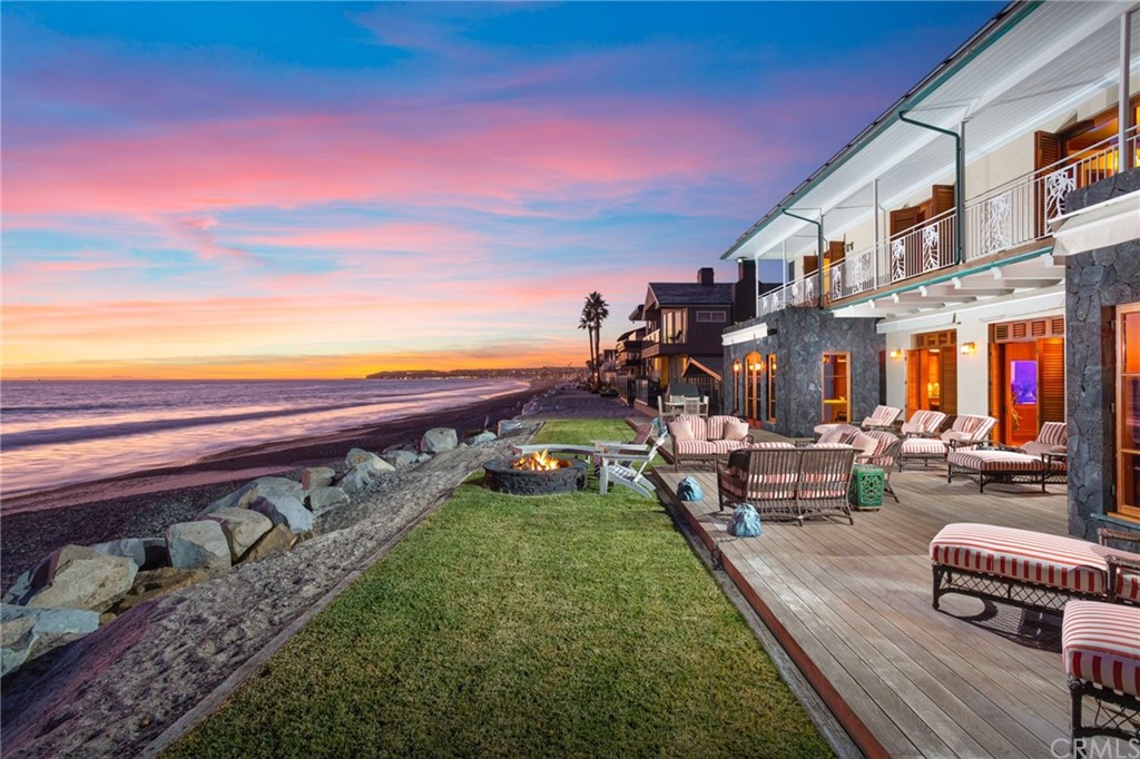 35475 Beach Road Dana Point, CA 92624 - Photo 2 of 59 a view of a swimming pool with lawn chairs and a fire pit