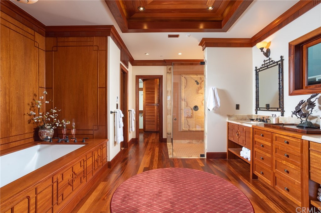 35475 Beach Road Dana Point, CA 92624 - Photo 25 of 59 a spacious bathroom with a double vanity sink a large mirror and shower