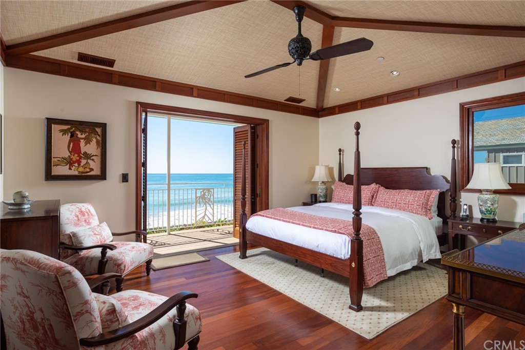 35475 Beach Road Dana Point, CA 92624 - Photo 26 of 59 a bedroom with a bed a couch and a ceiling fan